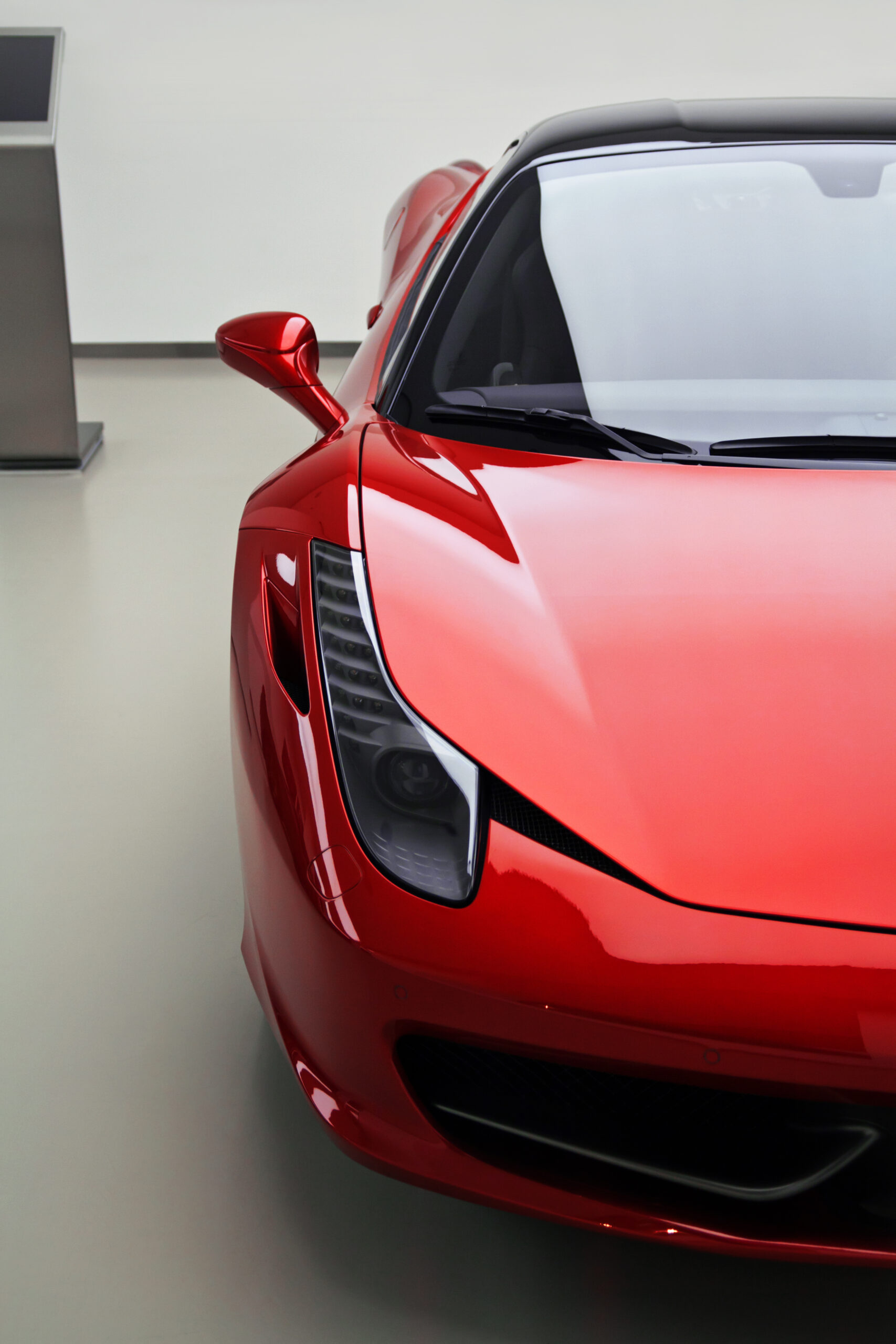 front view on red sport car in garage